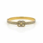 Gold Plated CZ Bangle Bracelet | Trendy Jewel | Anti-Tarnish Jewellery for Women | Elegant Interlocking Emblem Design