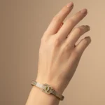 Gold Plated CZ Bangle Bracelet | Trendy Jewel | Anti-Tarnish Jewellery for Women | Elegant Interlocking Emblem Design