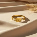 Gold Plated Designer Ring with Logo and Diamond-Like Stones | Trendy Jewel | Anti-Tarnish Jewellery for Women