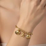 Anti-Tarnish Sea Charm Gold Bangle Bracelet | Starfish & Shell Charms | Trendy Jewel | Skin-Friendly Nickel-Free | Cable Twist Design